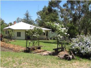 Large country home with established garden overlooking the river